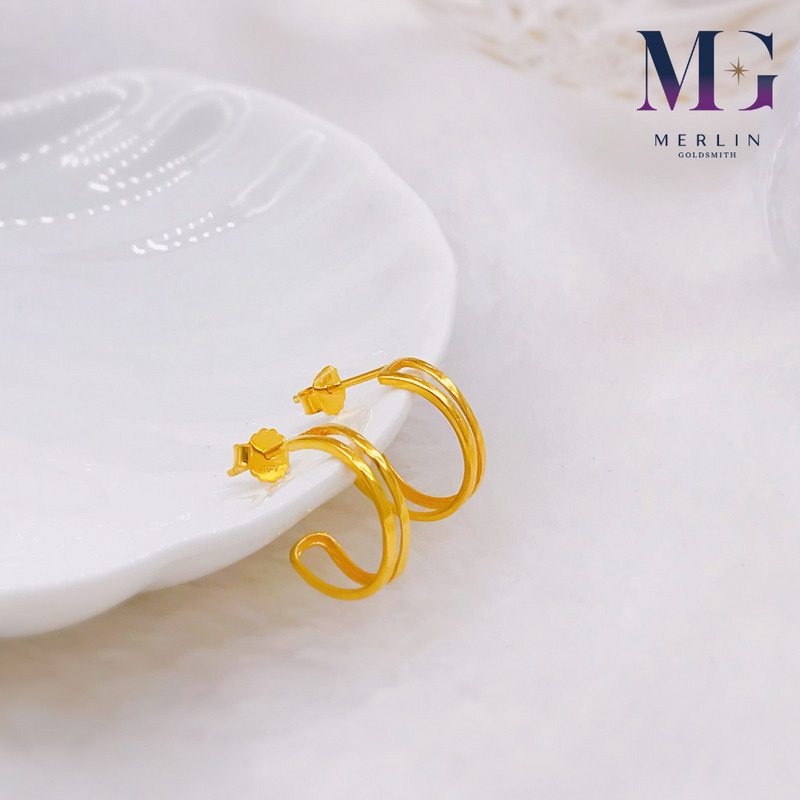 Gold double band half hoop earrings on a white shell dish from Merlin Goldsmith