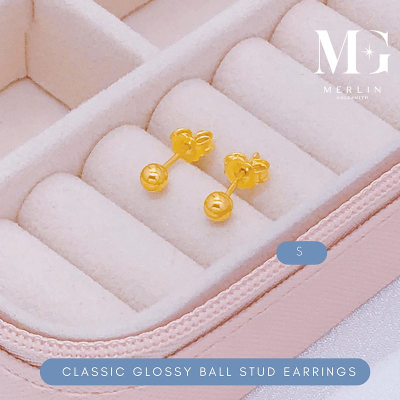 Classic glossy gold ball stud earrings on a pink jewellery box from Merlin Goldsmith