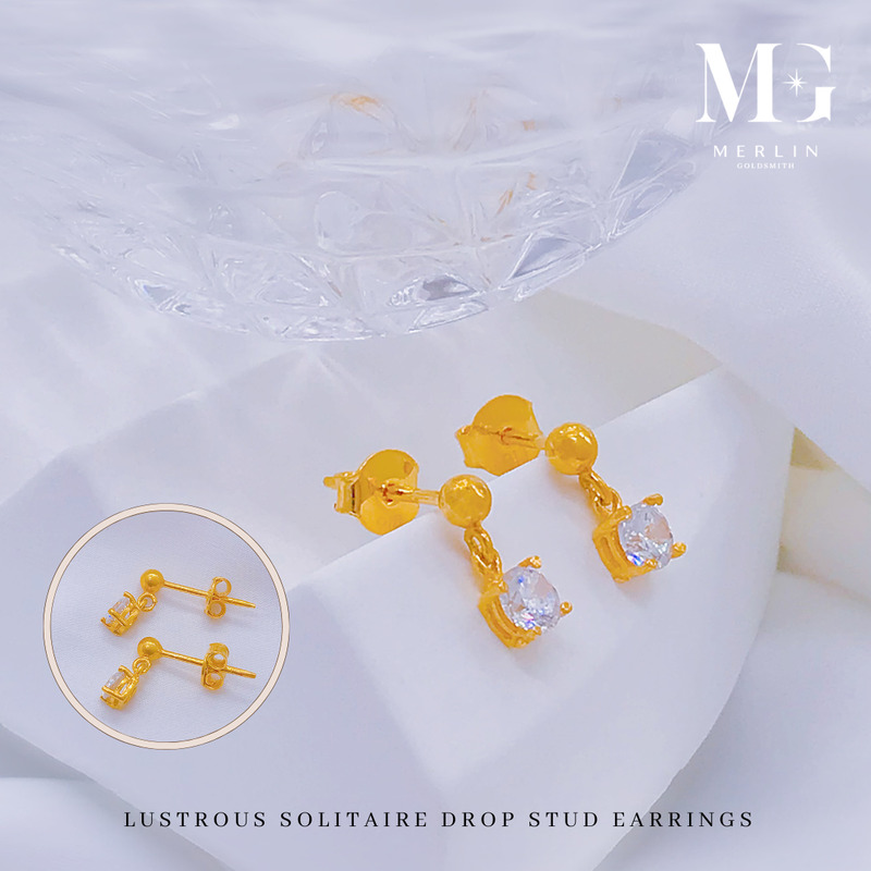 Lustrous solitaire drop stud earrings in gold with a single clear stone, with a close up of the earring backs from Merlin Goldsmith